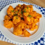 Buffalo Tempura Cauliflower sitting on a plate