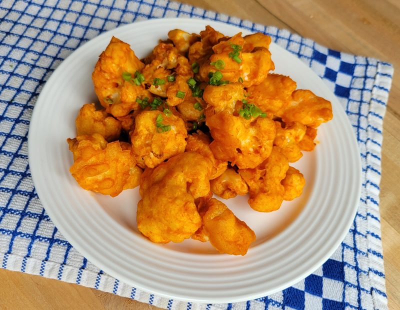 Buffalo Tempura Cauliflower sitting on a plate