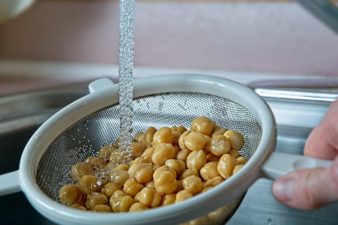 Rinsing Raw Chickpeas in a Strainer