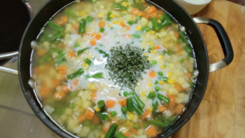 Adding Broth, Milk, and Herbs to Pot Pie Filling