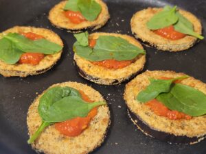 Assembling Eggplant Stacks with Marinara and Spinach